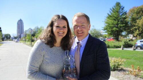 Tim and Jess McCulloh smiling in the sunshine.