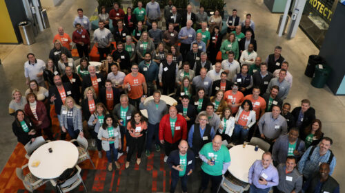 A group of the BTV investors and cohort looking up at a camera above them.