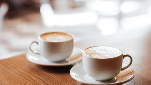 Two coffee cups on a table