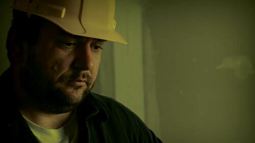 a construction worker thinking about his mental health