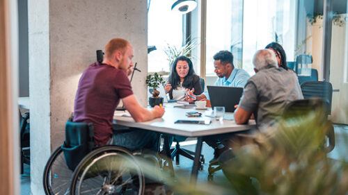 A group of diverse employees working together.