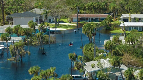 Houses, roads, cars underwater and flooded.