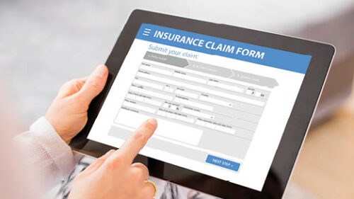 An online insurance claims form displayed on a tablet