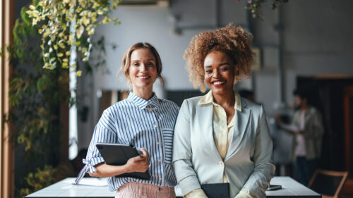 Two business women in a office.