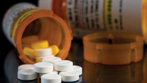 A prescription drug bottle open