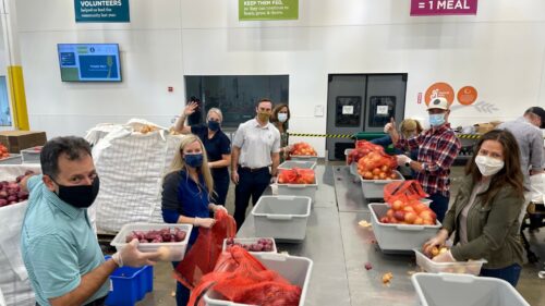 CSDZ team packing meals and volunteering