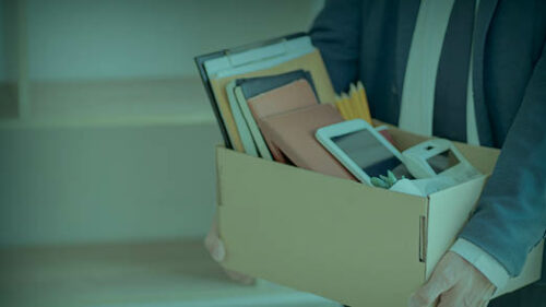 An employee carrying a box