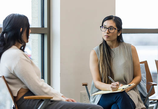 Two business professionals talking seriously.